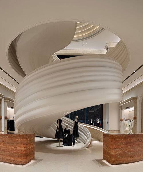 chongqing flagship's theatrical interiors by liang architecture evoke silk drapery in motion