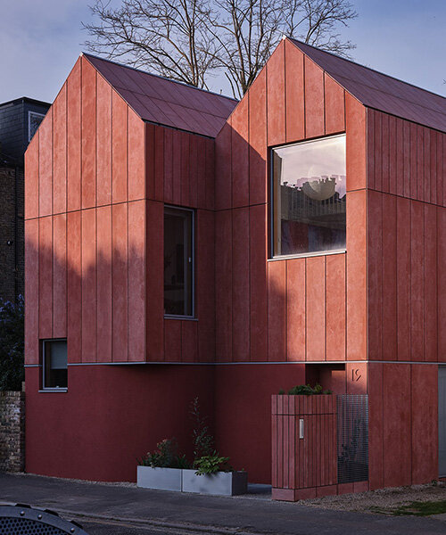 monochromatic facade wraps graeme williamson's dual-gabled 'twin house' in london