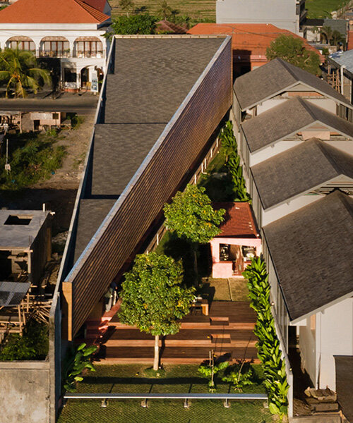 restaurant by studio kota cascades down balinese terrain in a series of open-air platforms