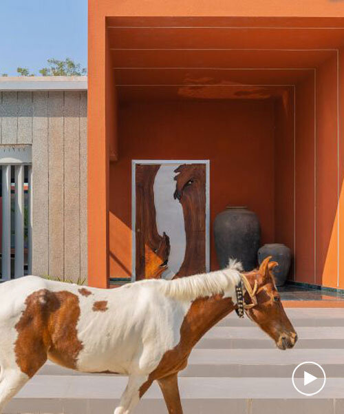 linear, unbroken wall encloses weekend villa by maanchitra in rural india